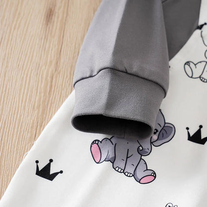 Baby boy wearing a long-sleeve romper with an elephant print and faux braces