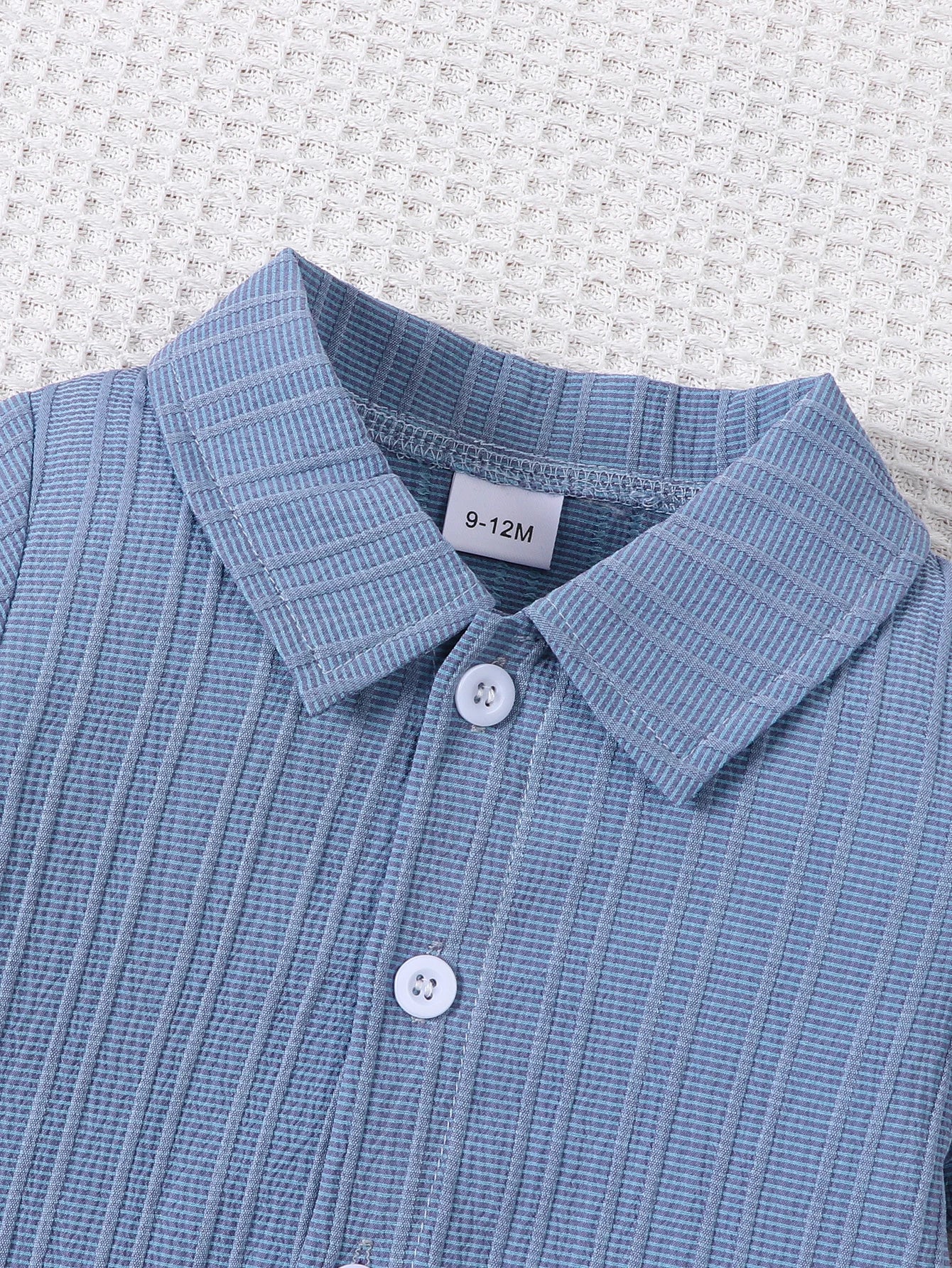 Styling option and alternate perspective of the baby boys woven jacquard shirt and shorts set