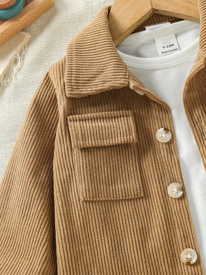Close up detail of baby boys stylish jacket & pants outfit