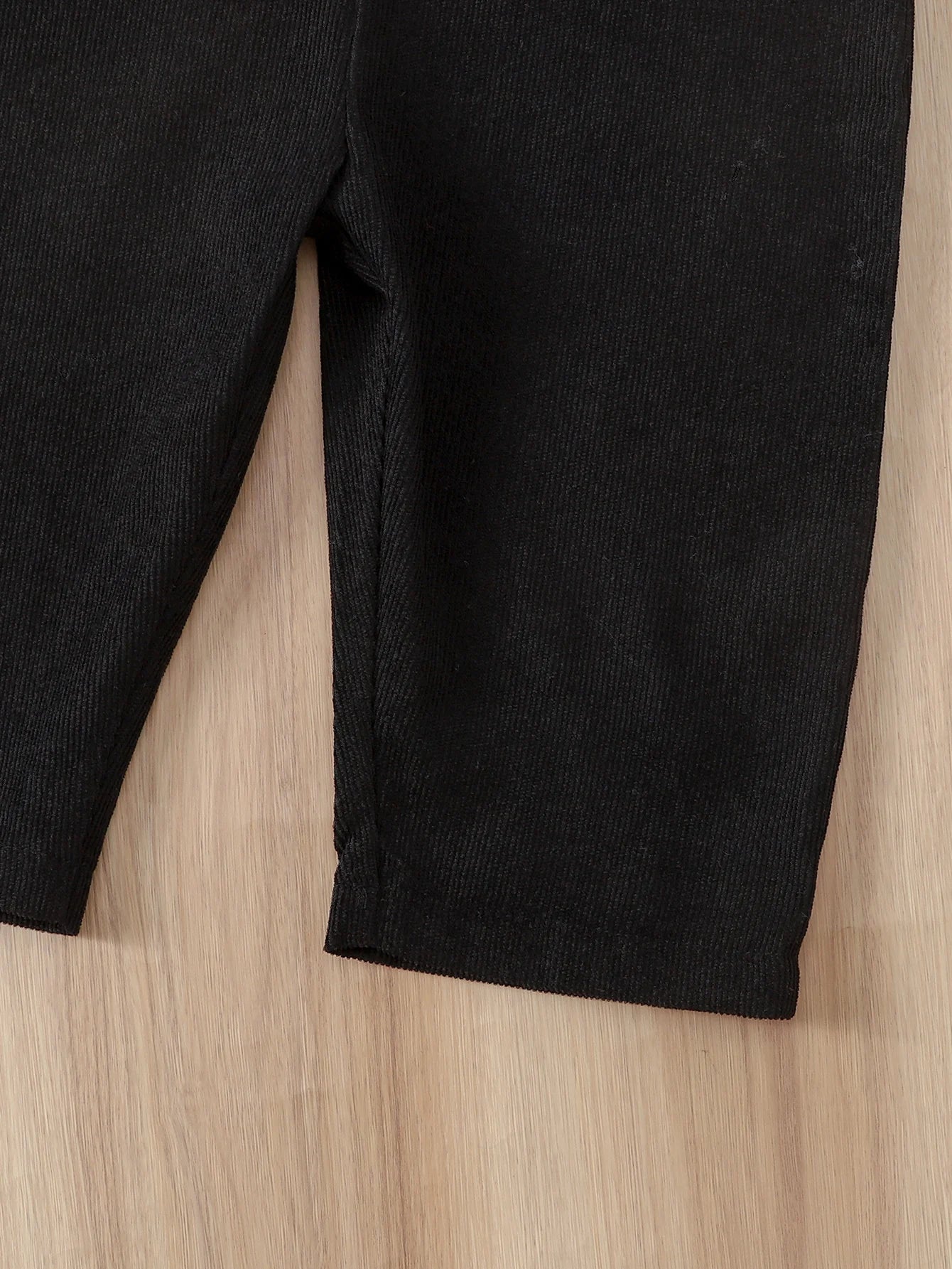 Side or lifestyle view of baby corduroy warm fluffy winter overalls