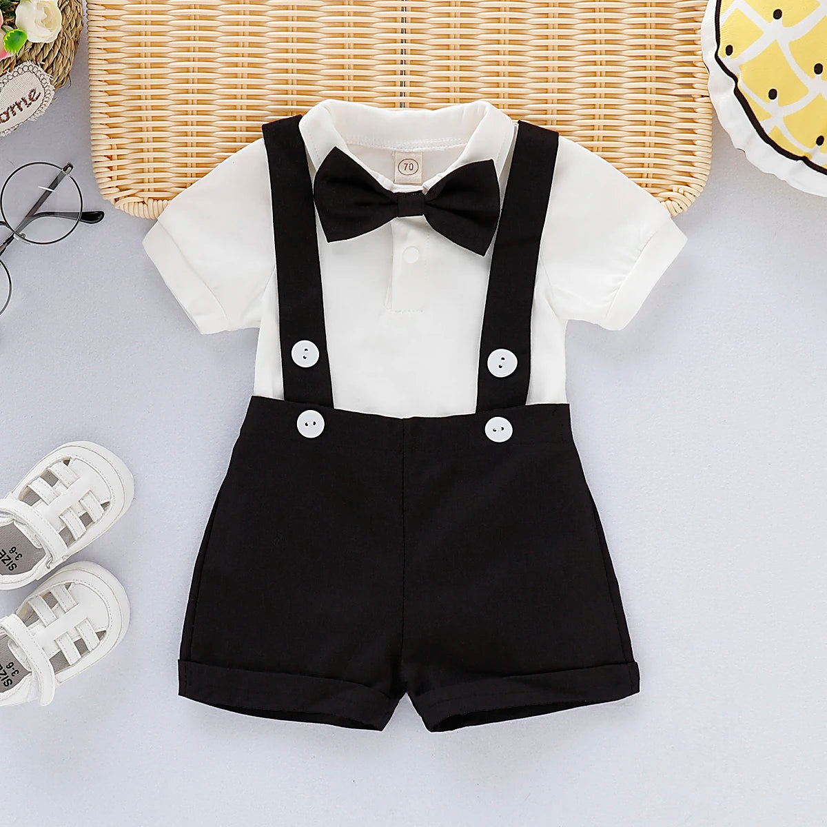Close up detail of baby boys formal shirt & shorts romper set