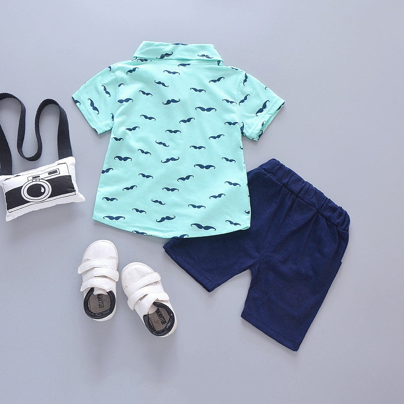 Close up detail of boys printed summer shirt & shorts suit