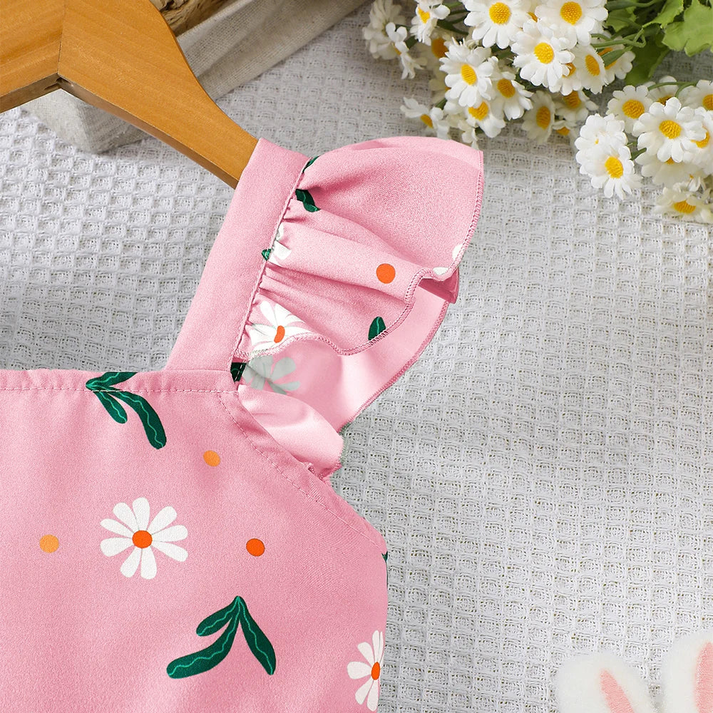 Detail view showing the fabric finish and pattern of the girls botanical print flutter sleeve dress