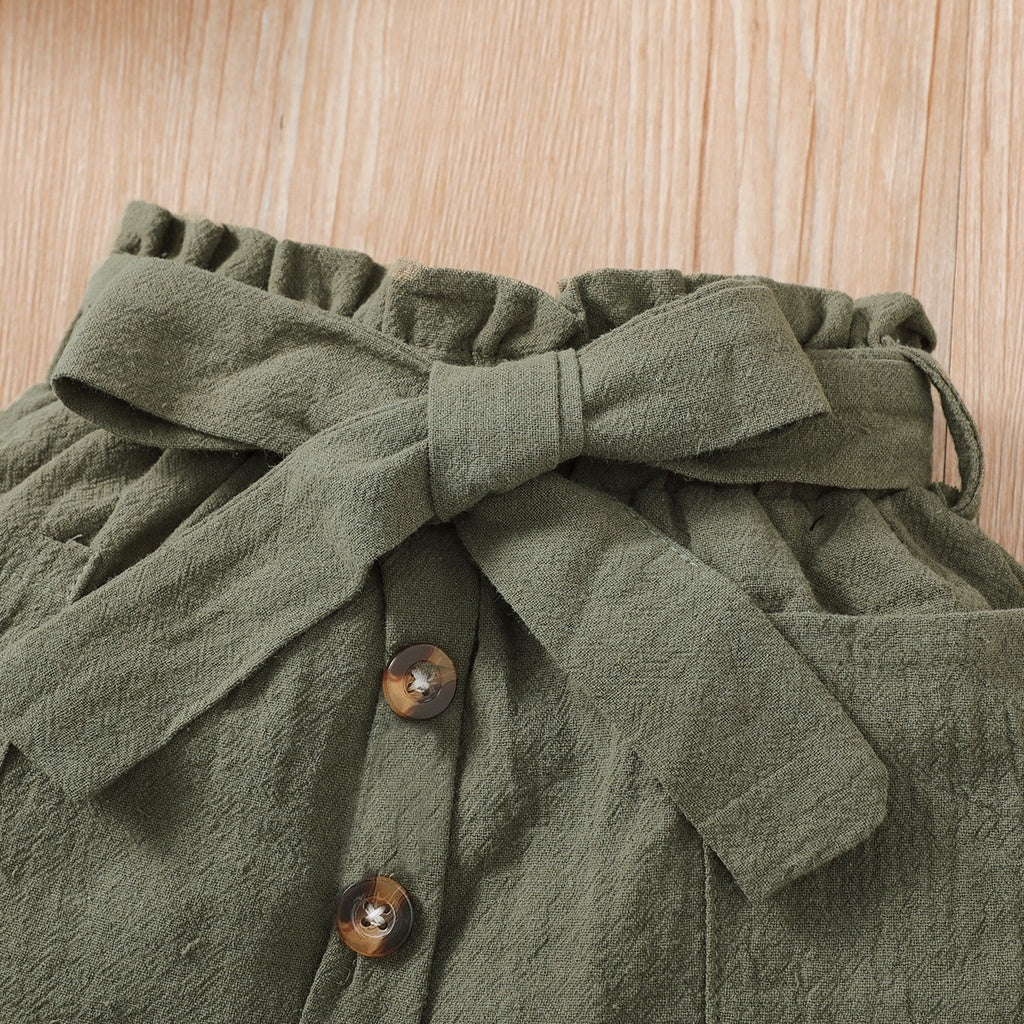 Baby girl wearing a ribbed halter top and matching short skirt