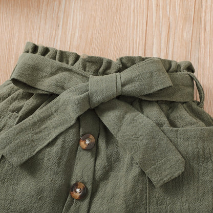 Baby girl wearing a ribbed halter top and matching short skirt