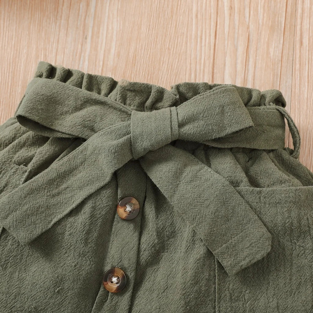 Baby girl wearing a ribbed halter top and matching short skirt