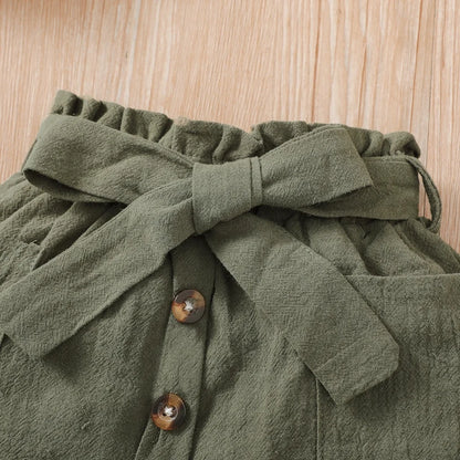Baby girl wearing a ribbed halter top and matching short skirt