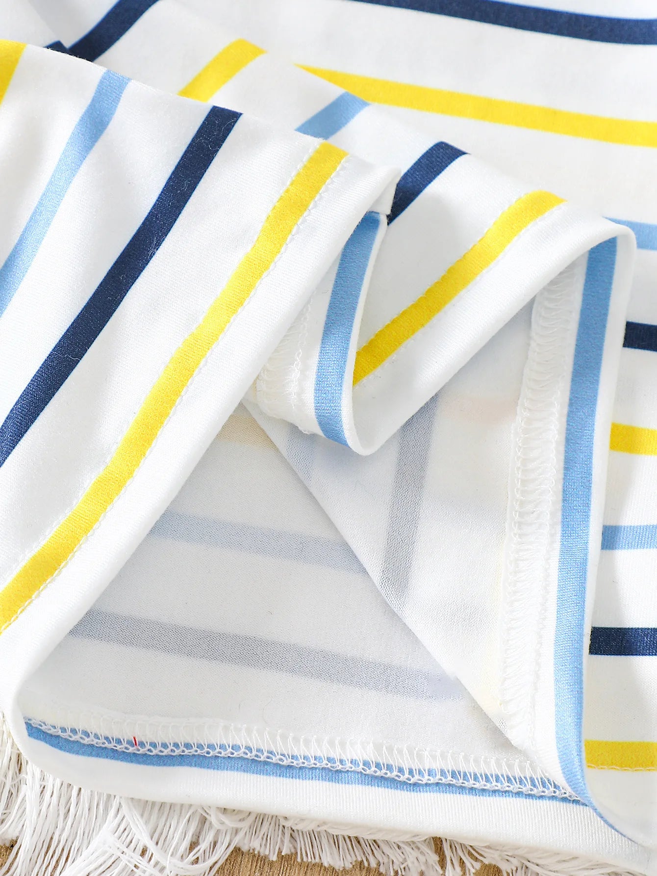 Side or lifestyle view of baby boys striped t-shirt and bear denim overalls set