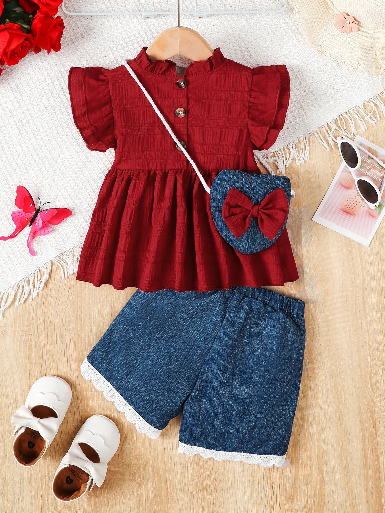 Feature focus detail of the baby girls ruffle top, shorts and bag set - view 2