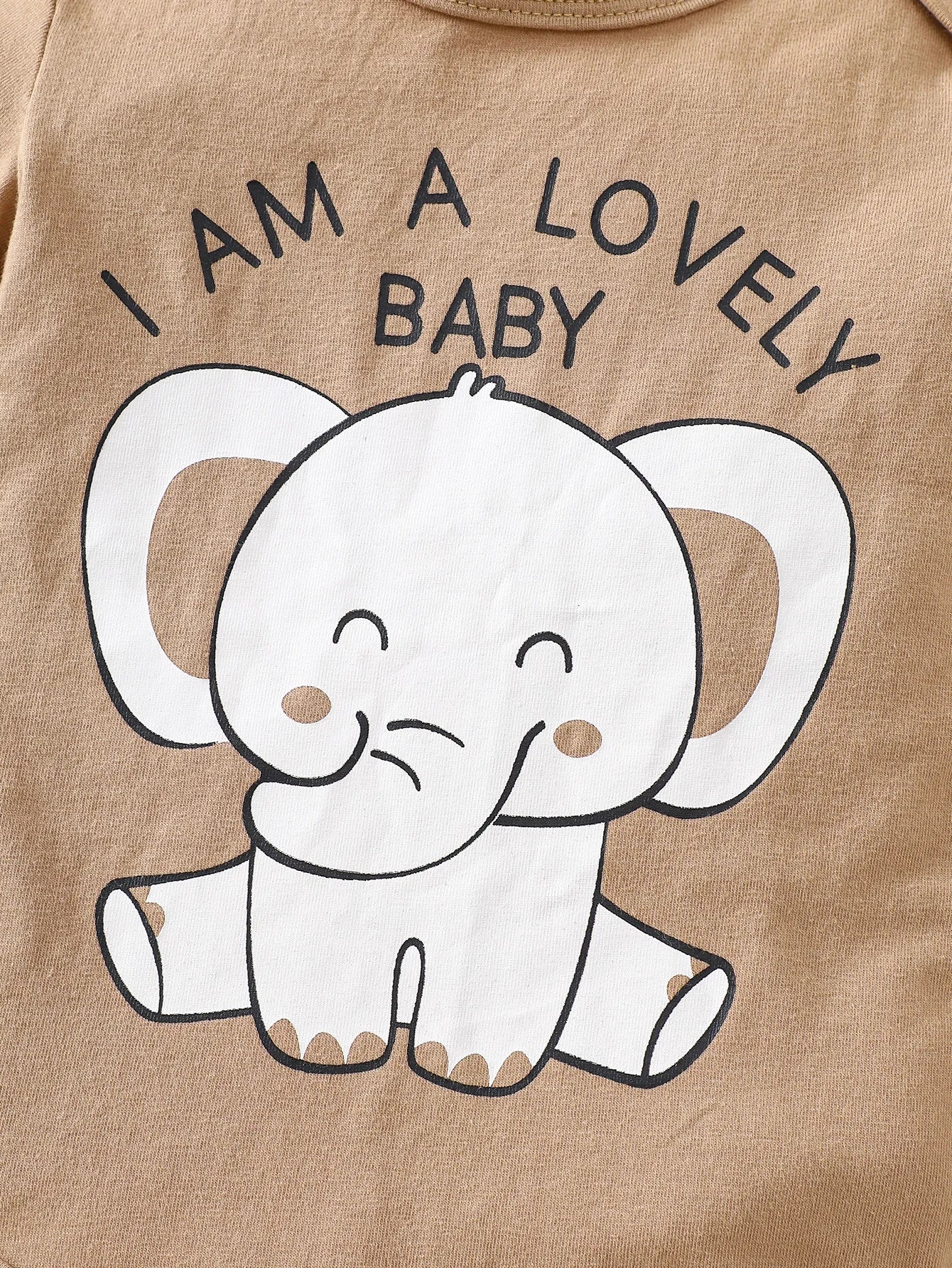 Close up highlighting the hem and stitching on the baby boys elephant print romper four-piece set