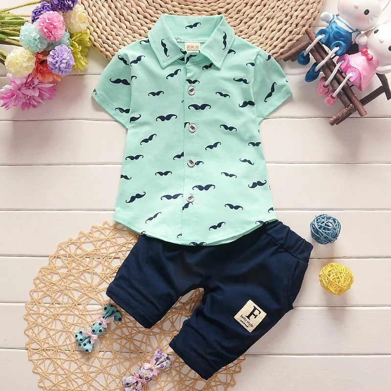 Back view of boys printed summer shirt & shorts suit