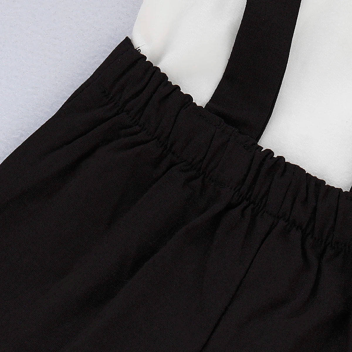 Side view of baby boys formal shirt & shorts romper set