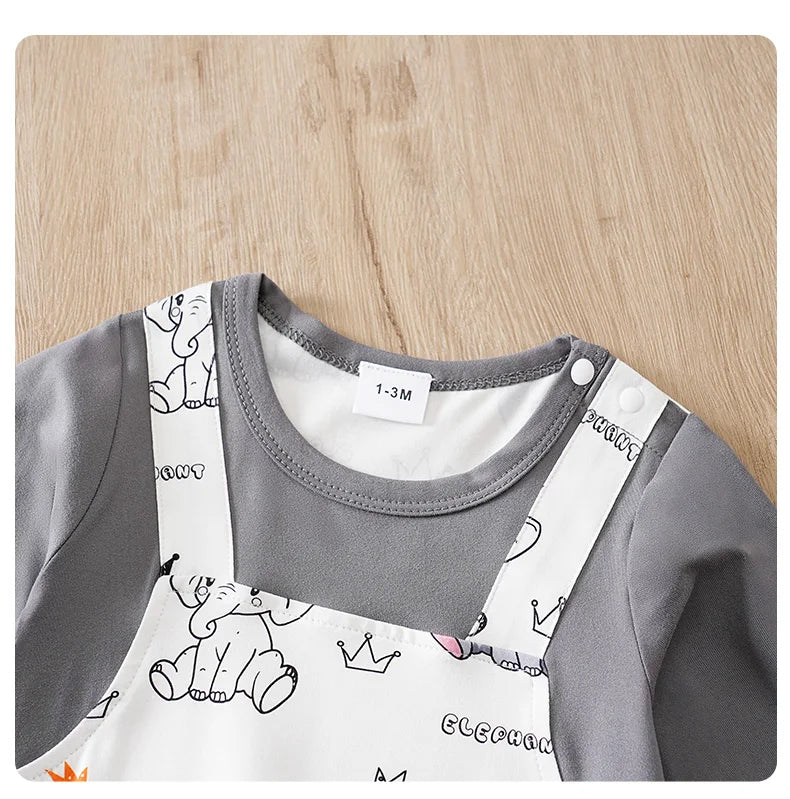 Baby boy wearing a long-sleeve romper with an elephant print and faux braces