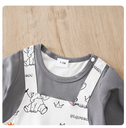 Baby boy wearing a long-sleeve romper with an elephant print and faux braces