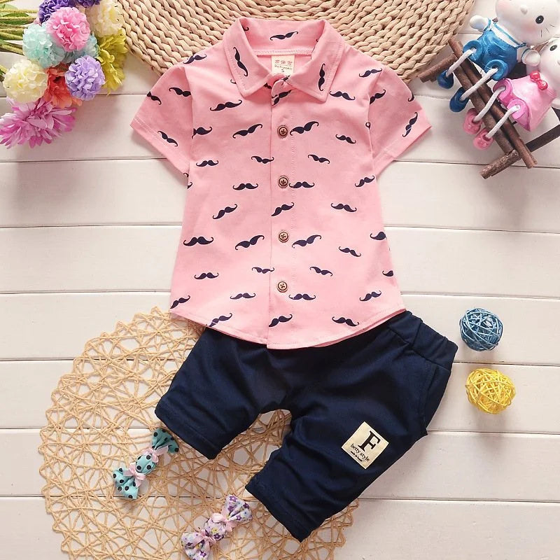 Close up detail of boys printed summer shirt & shorts suit