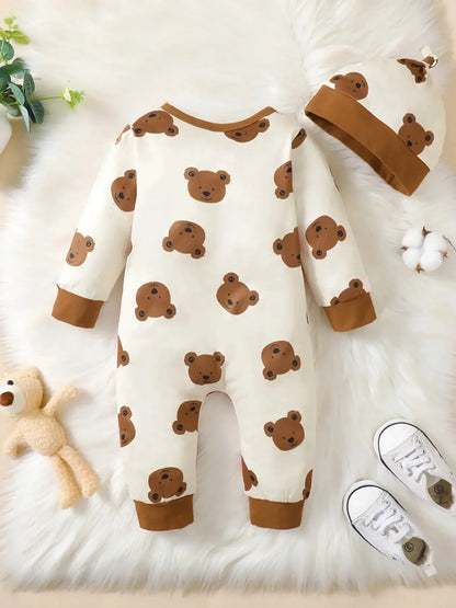 Close-up material detail of baby boys bear print button-up winter romper