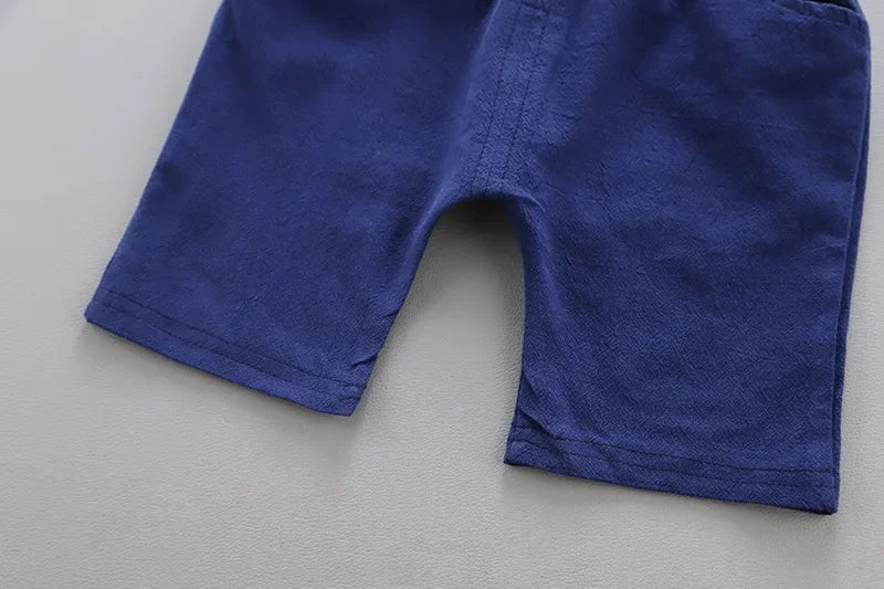 Detail view showing the fabric finish and pattern of the baby boys casual summer top and shorts set