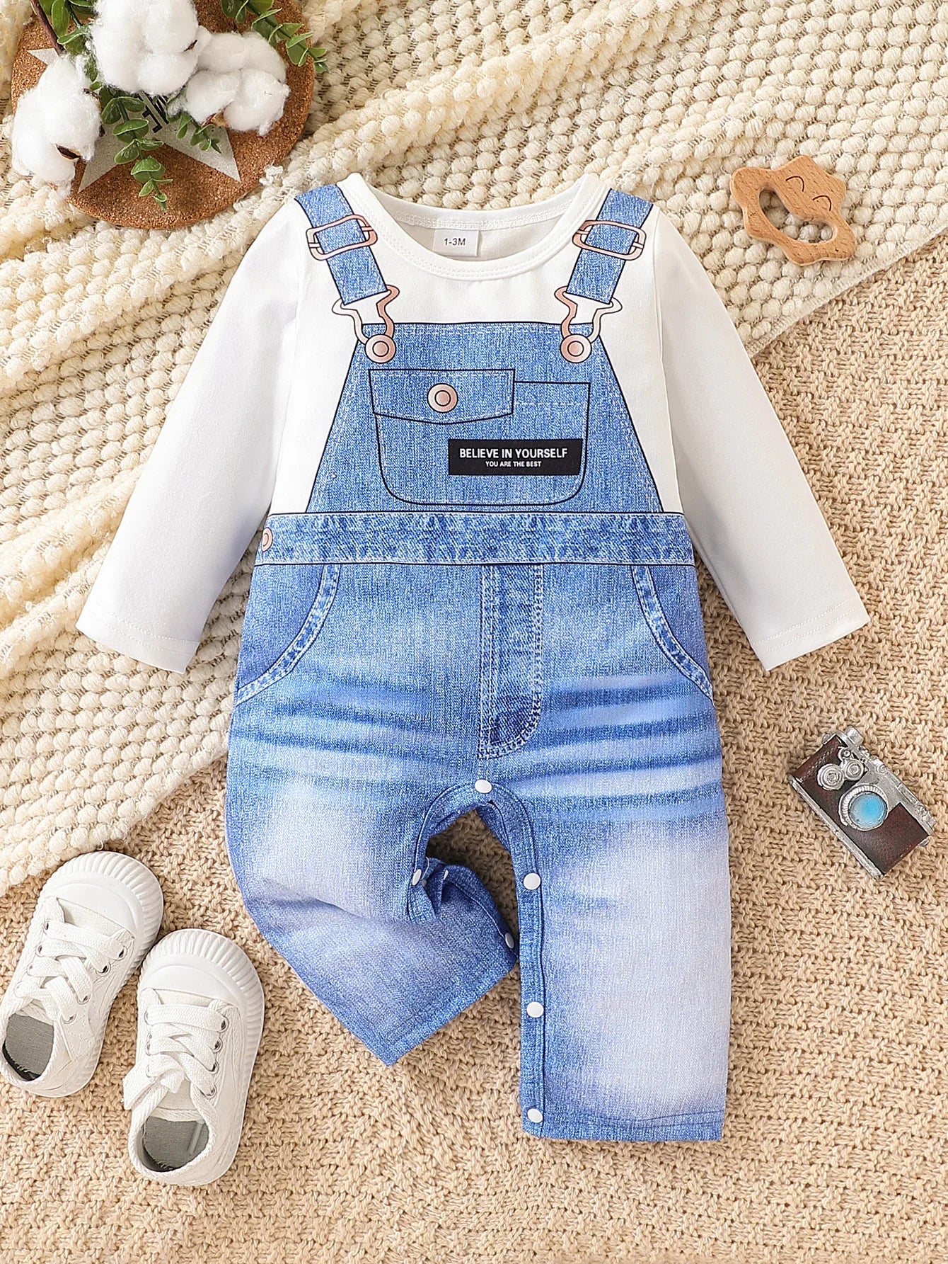 Baby boys long-sleeve romper featuring a faux denim overalls print