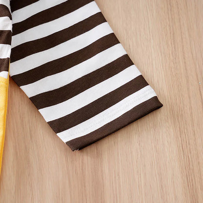 Styling option and alternate perspective of the baby striped elephant and giraffe print romper