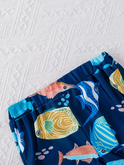 Side or lifestyle view of boys shark print short sleeve swimwear set