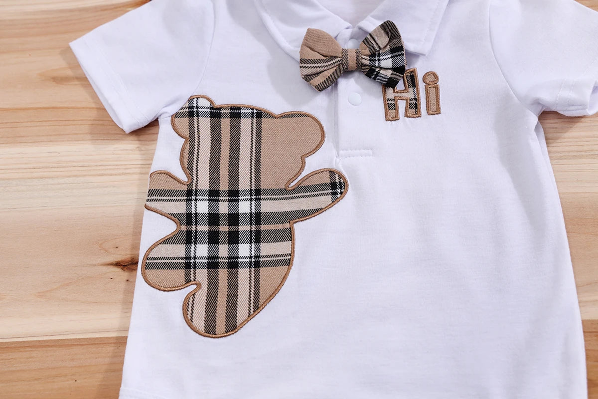 Close up detail of baby boys plaid bear bodysuit & trousers set