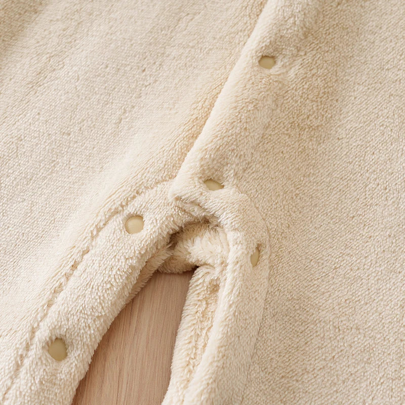 Fabric and texture detail of baby bear hooded winter flannel romper