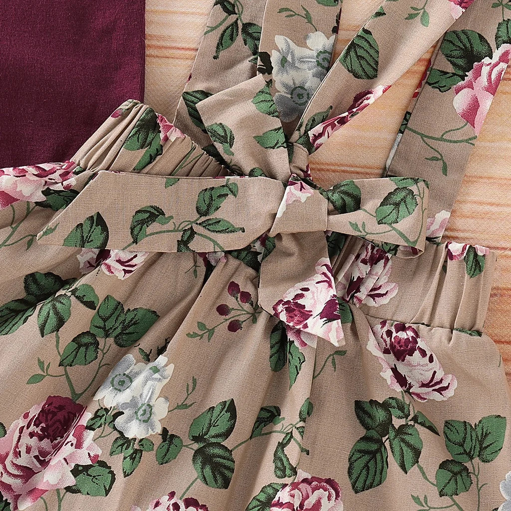 Different colour variation or layout view of the baby girls christmas floral romper and suspender skirt set
