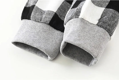 Close up detail of boys plaid long sleeve hooded jacket