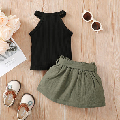Baby girl wearing a ribbed halter top and matching short skirt