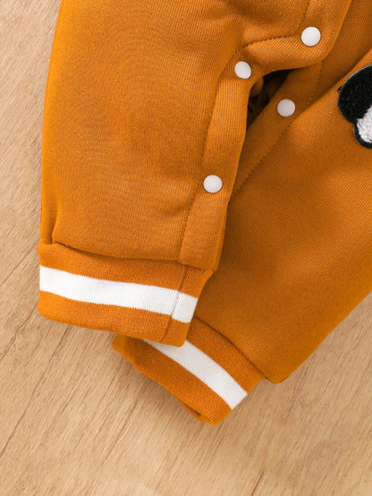 Baby boy wearing a caramel and orange fleece-lined baseball style romper