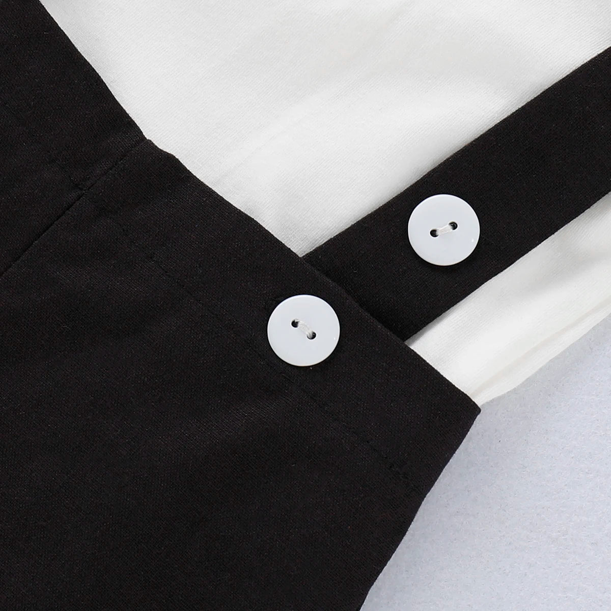 Close up detail of baby boys formal shirt & shorts romper set
