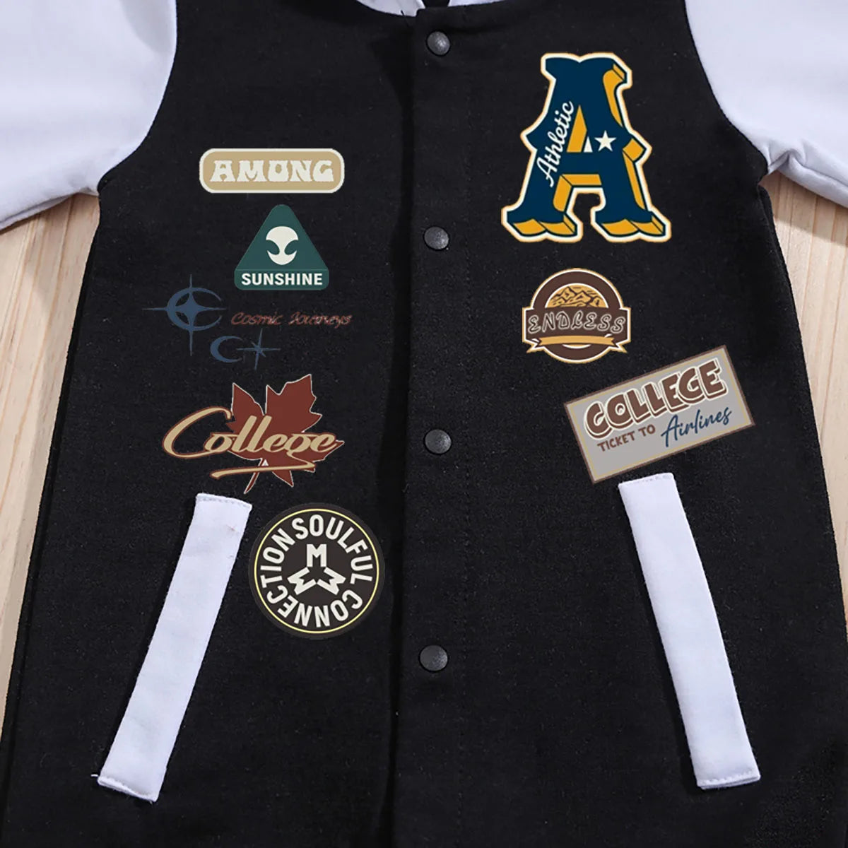 Close up detail of baby boys hooded baseball romper jumpsuit
