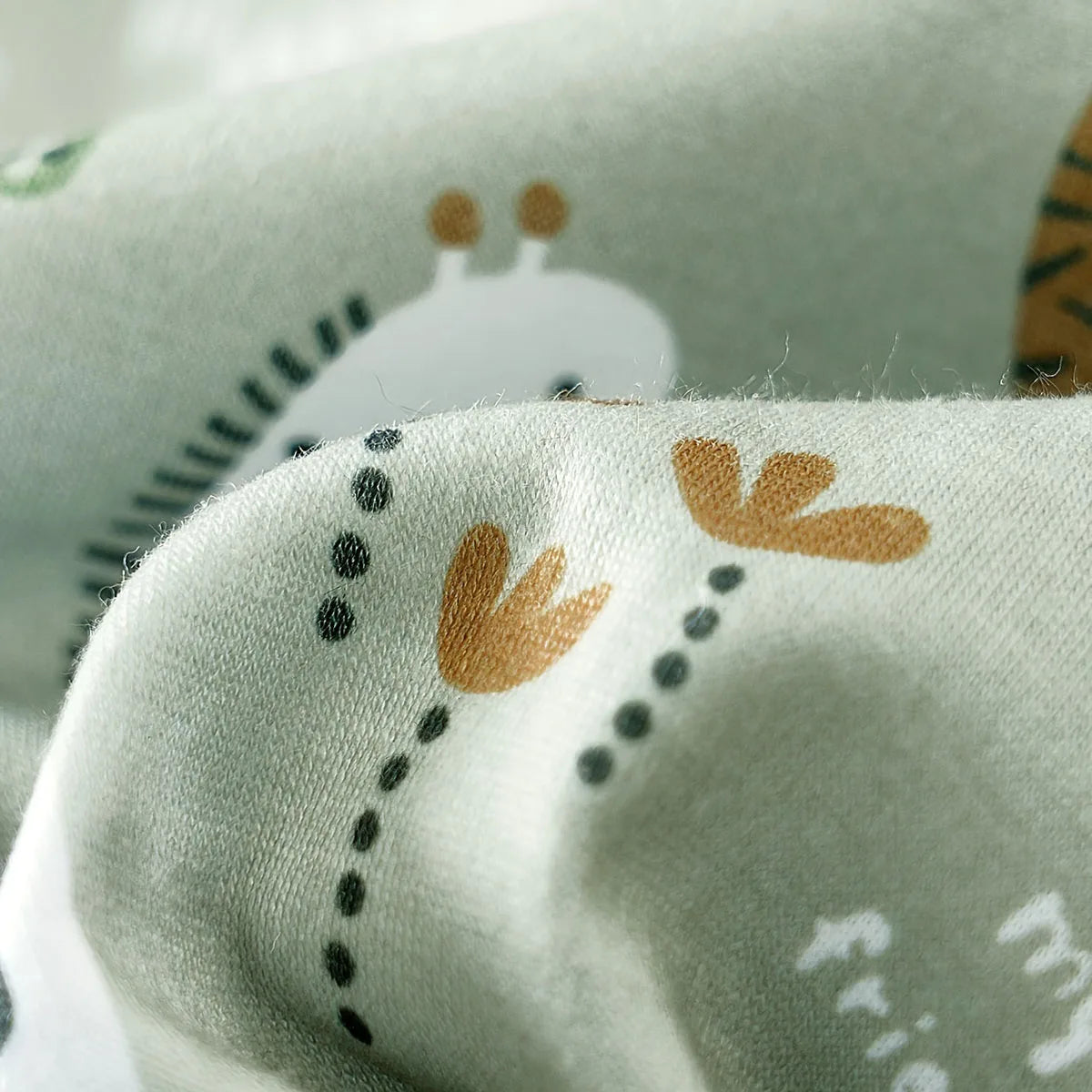 Back or secondary profile shot of the baby boys zoo animal print short sleeve romper