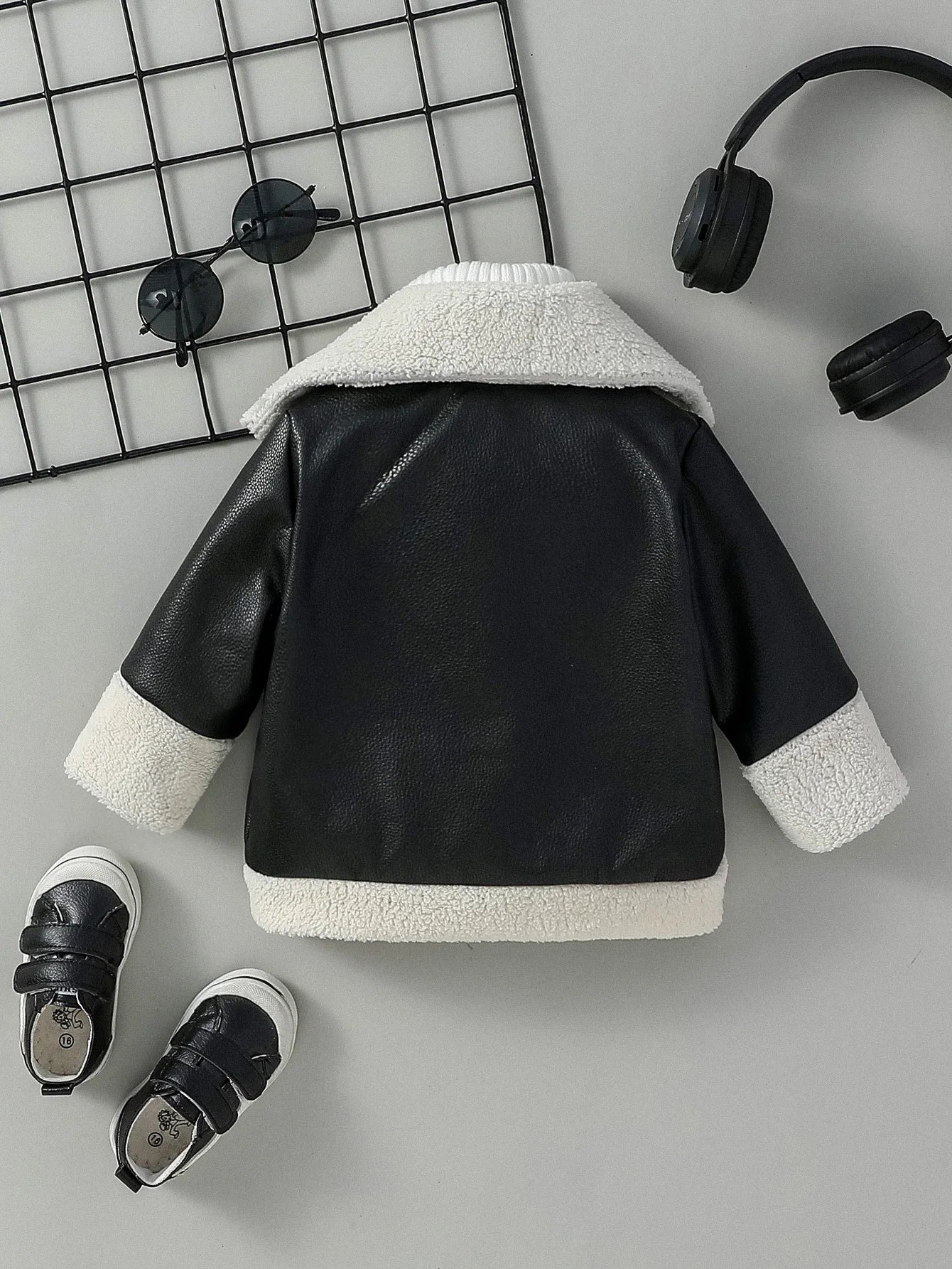 Turn-down collar detail on baby boys black jacket