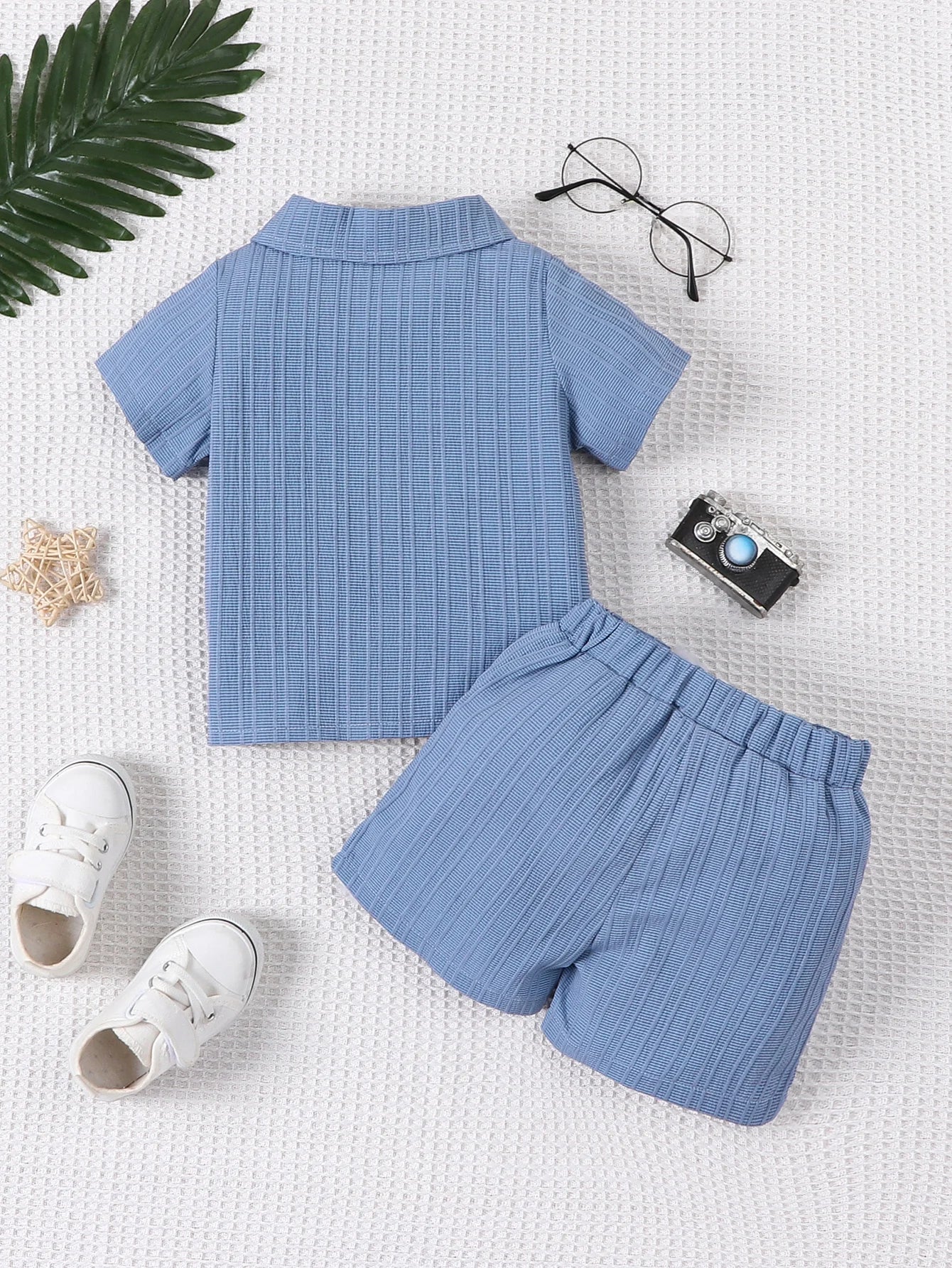 Detail view showing the fabric finish and pattern of the baby boys woven jacquard shirt and shorts set