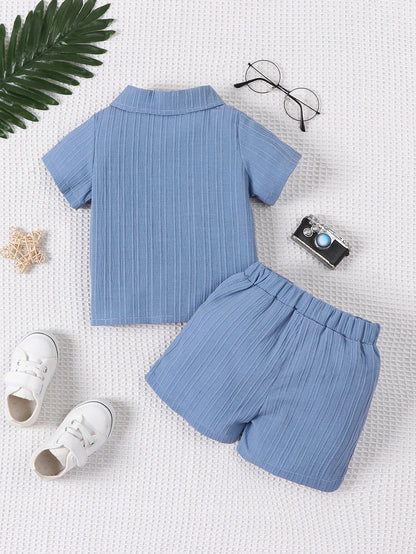 Detail view showing the fabric finish and pattern of the baby boys woven jacquard shirt and shorts set