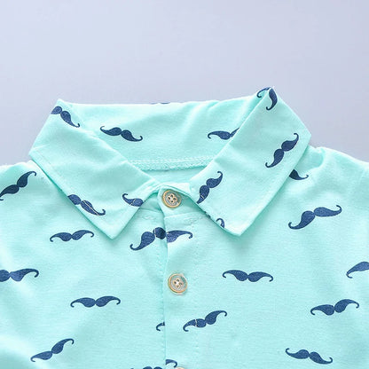 Side view of boys printed summer shirt & shorts suit