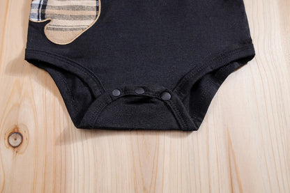 Fabric and texture detail of baby boys plaid bear bodysuit & trousers set