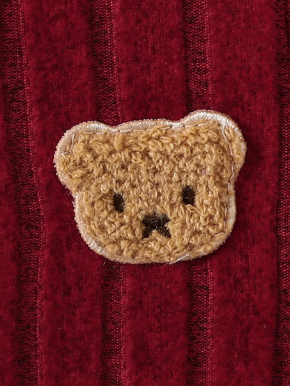 Side view of baby boys red bear badge onesie & hat set