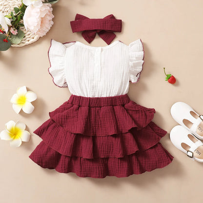 Feature focus detail of the baby girls red wine layered cupcake dress - view 2