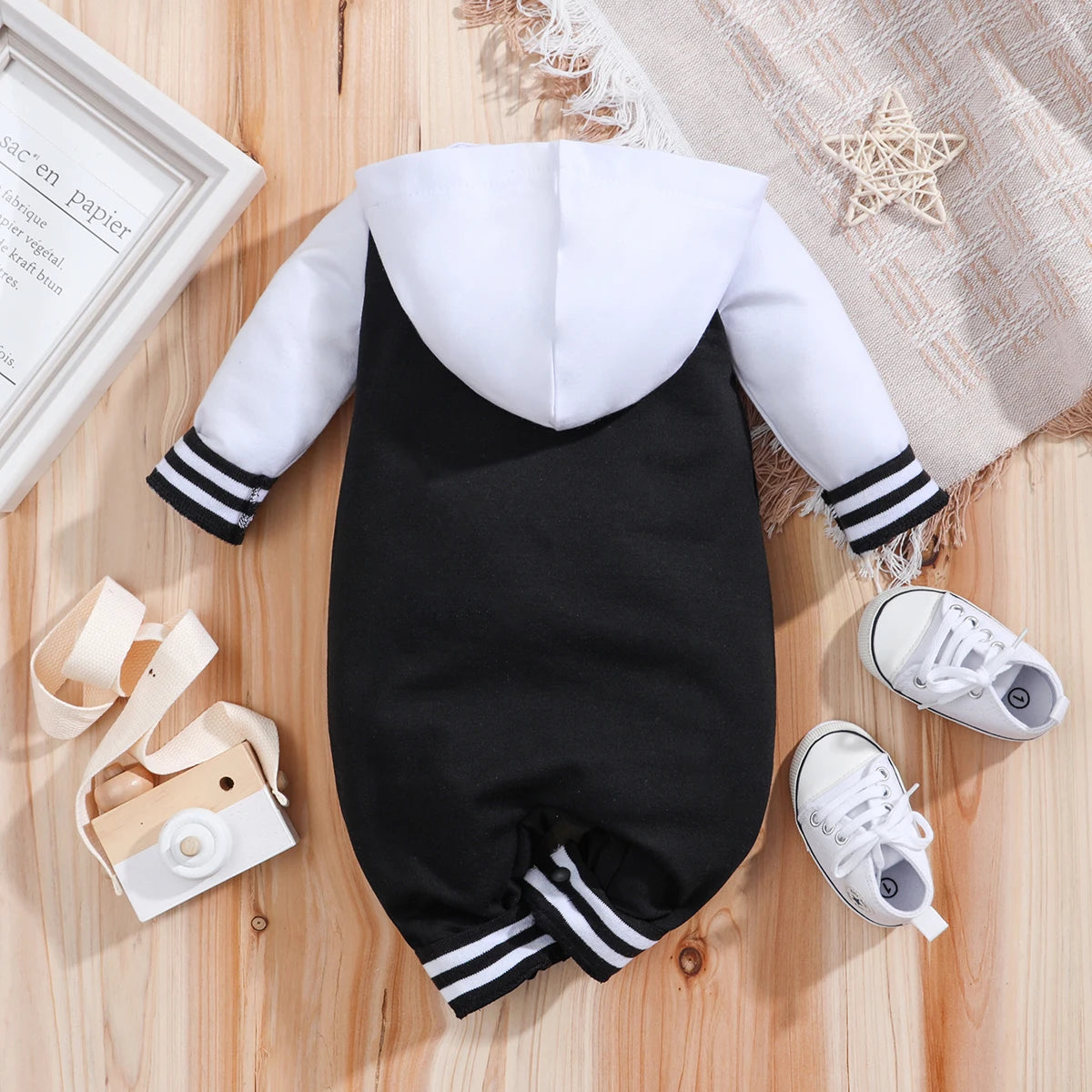 Side view of baby boys hooded baseball romper jumpsuit