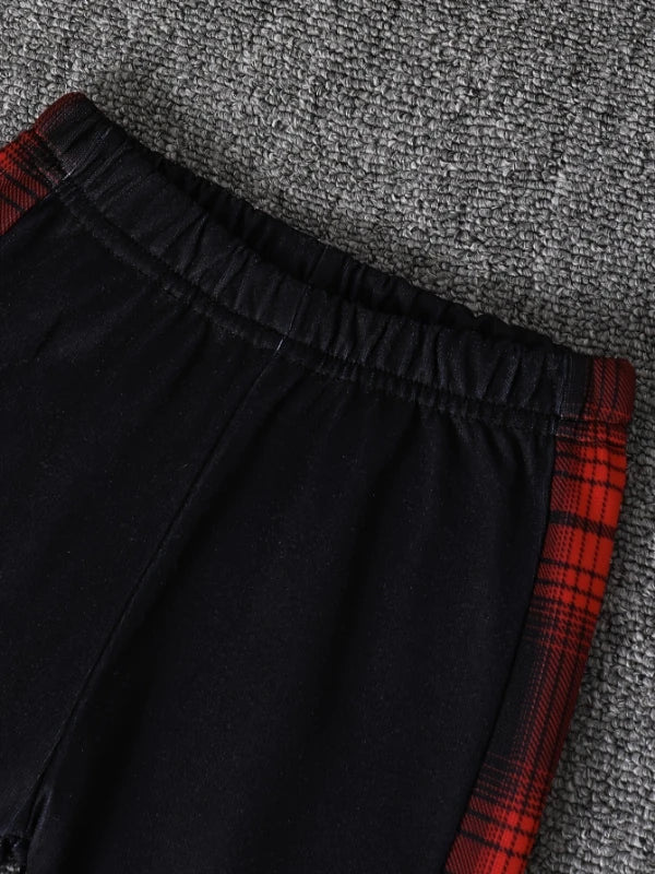 Fabric and texture detail of baby boys plaid fleece lined hooded outfit