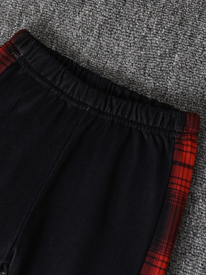 Fabric and texture detail of baby boys plaid fleece lined hooded outfit