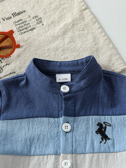 Back or secondary profile shot of the baby boys patchwork short sleeve shirt and shorts set