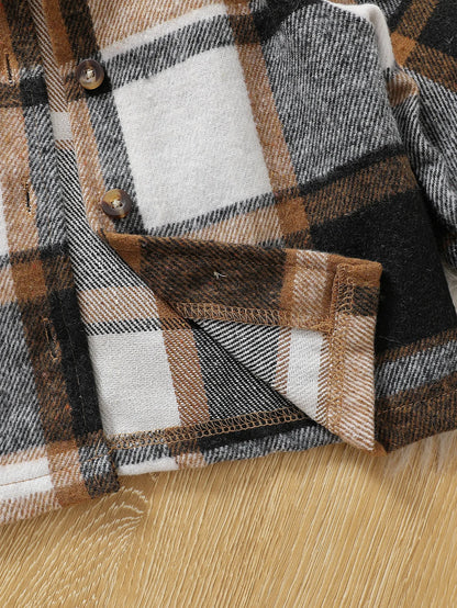 Close up detail of boys striped hooded jacket & ripped pants