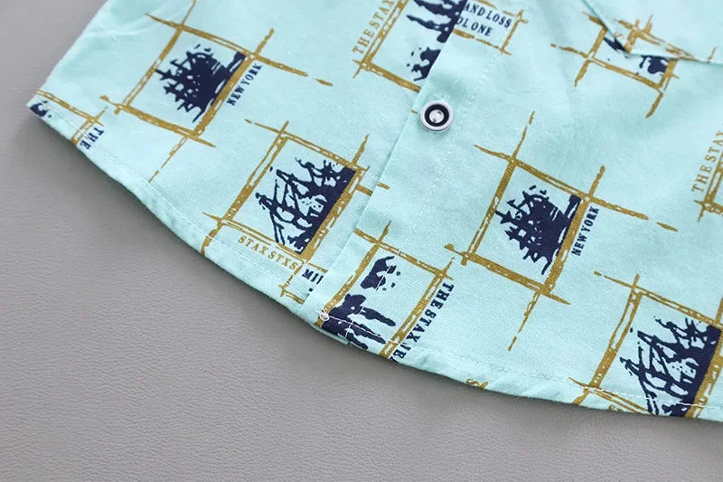 Close up highlighting the hem and stitching on the baby boys casual summer top and shorts set