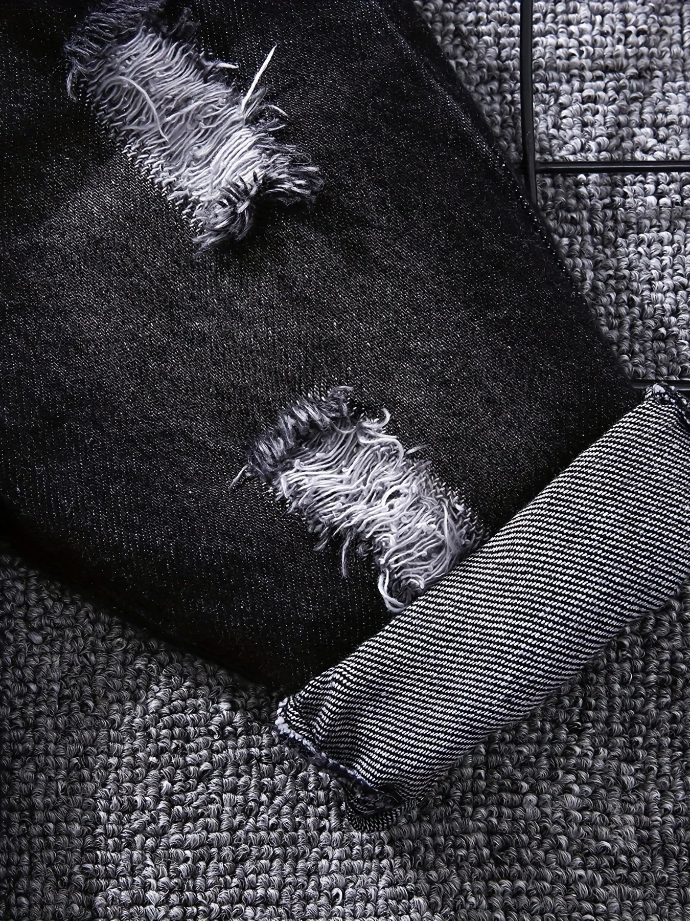Close up detail of boys tartan polo shirt & denim trousers set