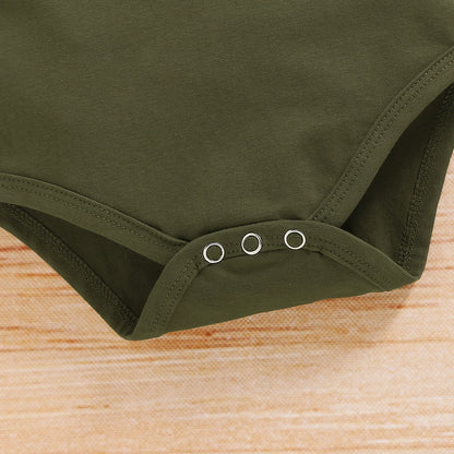 Detail view showing the fabric finish and pattern of the baby boys camouflage shorts and letter print romper set