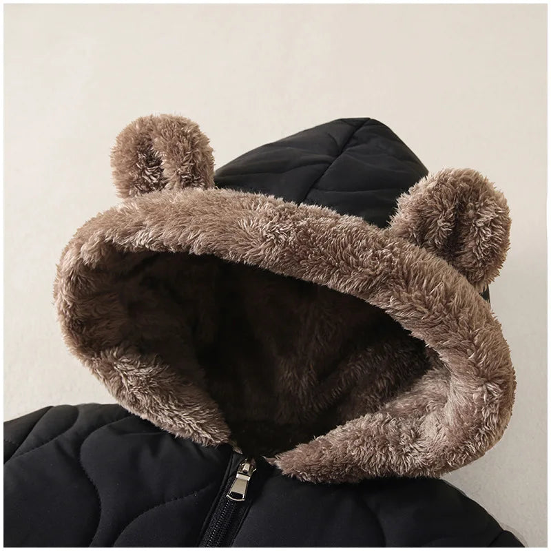 Fabric and texture detail of baby fleece lined hooded winter onesie