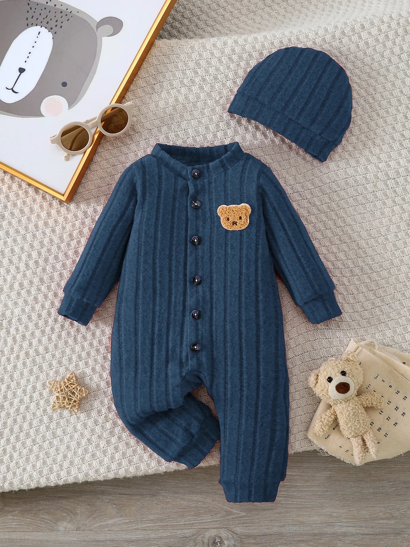 Side view of baby boys red bear badge onesie & hat set